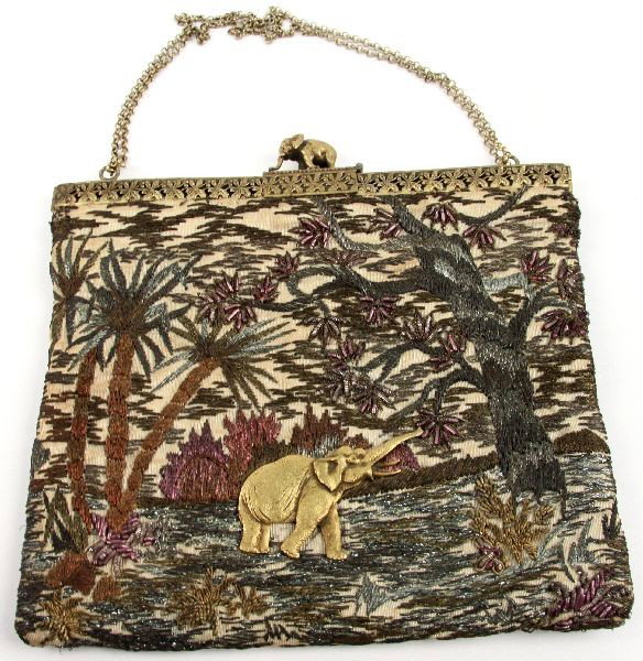 ANTIQUE BULLION EMBROIDERED ELEPHANT HANDBAG: 6.5 by 6 inches. Silk handbag with gold and silver bullion embroidery work. Elephant and jungle motif. Applied gold metal elephant. Double hinged top opens to square shape. Elephant clasp. Soldered li