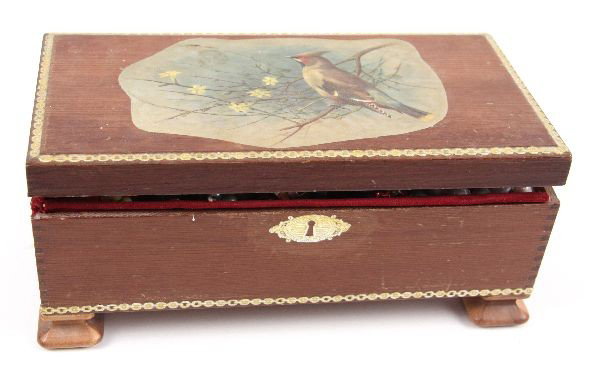 MIXED LOT OF COSTUME JEWELRY WITH TRINKET BOX: Variety of costume jewelry including necklaces, watches, rings, pendants, and a range of clip on earrings. All kept in a wooden trinket box pictured with a bird and flowers on cover. Overall in good c