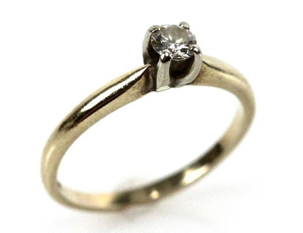 LADIES 14K YELLOW GOLD DIAMOND SOLITAIRE: Ladies 14K yellow gold 0.25 ct diamond solitaire, size 6. Band is worn, and has some surface scratches. Size: 6 Weight: 1.8 g Condition: Band is worn and has some surface scratches, overall in good co