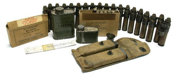VINTAGE MILITARY CARTRIDGES AND SHOOTING ITEMS: Lot of WWII era shooting related items. 2 cans of bore cleaner, partial box of 30-06 cartridges, linked .50 caliber brass, and canvas 1911 mag pouch. All in very good condition.
