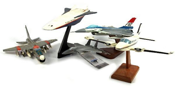 GROUPING OF 5 COMPANY MODEL AIRPLANES: Grouping of five company model planes. Including McDonnell Douglas F-15 Eagle, X-30 National Aerospace plane, A-7 with U.S.S. Nimitz squadron stickers, General Dynamics F-16E, and more.