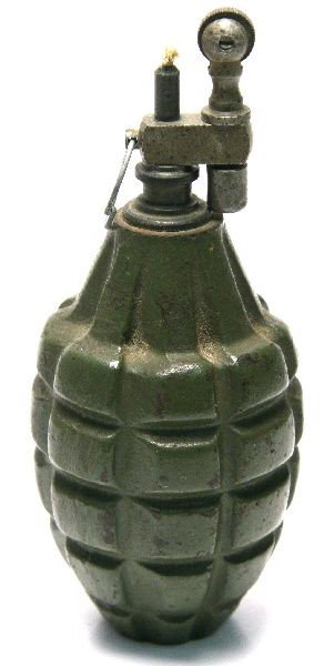 UNITED STATES WWII ERA GRENADE LIGHTER: United States WWII era grenade lighter. Measures 5 by 7.25 (diameter) inches, weighs 1.10 pounds. Features original paint and appears to be in working condition. Needs fluid and flint. Overall in very
