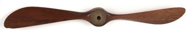 WWI TRENCH ART PROPELLER FRENCH COIN INSERTED: Eight inch hand carved WWI trench art propeller with two French coins imbedded at center, old crack near one of the coins.