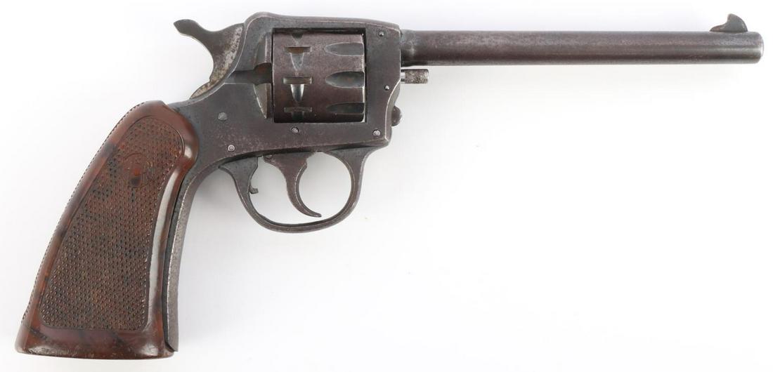 H&R ARMS COMPANY MODEL 922 .22 CAL REVOLVER: H&R Arms Company Model 922 .22 caliber nine shot double action revolver. 5 1/2 inch barrel. Manufacturers mark on left side of barrel. Plastic brown grip. Serial number on grip frame. Bore is bright a