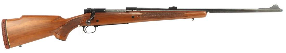WINCHESTER MODEL 70 BOLT ACTION RIFLE .338 WIN MAG: Blued steel barrel with wooden stock. Barrel measures 24 3/4 inches. Smooth action. Hair trigger. Bore is bright and clear. FFL required for transfer. No international shipping. Very good condition ov