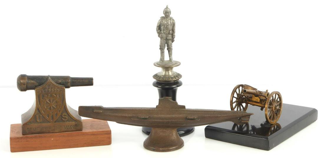 4 MODEL LOT REMEMBER THE MAINE PICKELHAUBE SUB: Remember the Maine cannon on 4 1/4 inch stand, WWI Prussian soldier in German silver, 5 3/4 inches, highly detailed cannon model on 4 3/4 stand, one of the seat backs is missing, and 7 1/2 inch bronze