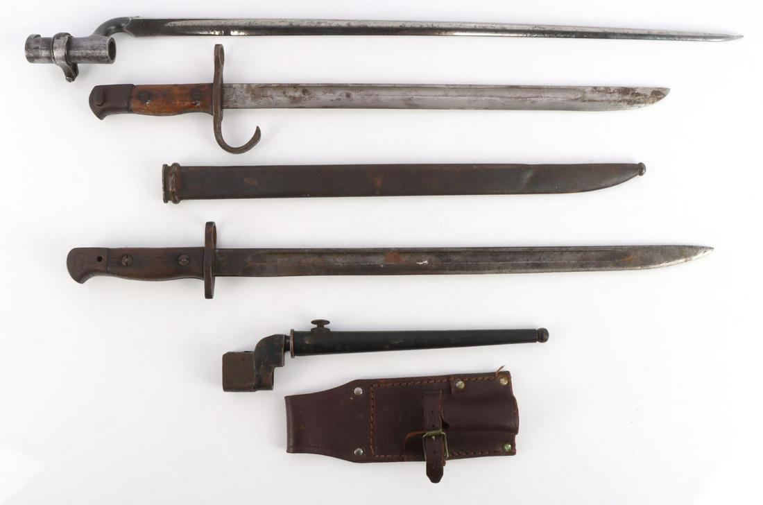 4 WWII ENGLISH IMPERIAL JAPANESE BAYONETS: Lot of 4 bayonets from the WWII era. One Imperial Japanese Type 30 bayonet with steel handle and wooden grips and minor loss near the crossguard. Crossguard has some play. pommel marked maker and numb