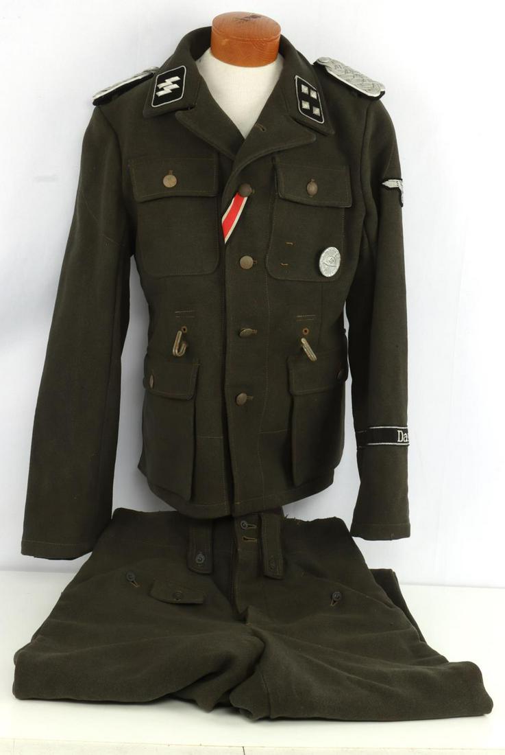 WWII GERMAN THIRD REICH STURMBANNFUHRER TUNIC: Tunic features SS collar tabs, eagle patch on left shoulder, Das Reich cuff title, pebbled buttons, and a wound badge marked 30. Non-fluorescing. Named to H. Dorn on interior left pocket. Size medium.