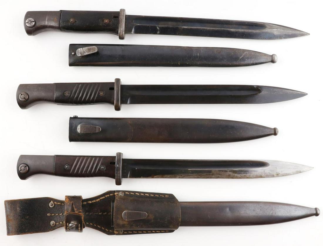 3 WWII GERMAN MAUSER K98 BAYONETS HORSTER: 3 WWII German Mauser K98 bayonets. One bayonet with wooden grips and steel handle with steel blade. Blade marked "E u F. Horster" and 9782 with 39 to the back of the blade. Scabbard with no denting ma