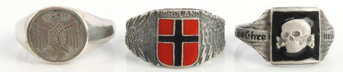 3 WWII GERMAN TOTENKOPF & WIKING SS SILVER RINGS: Lot of three (3) WWII German Reich rings including a Totenkopf SS Death Skull ring, size 12, weighs 5.2 grams. A 800 silver Nordland Wiking SS Ring, size 11.5, weighs 5.3. Lastly a 925 silver German H