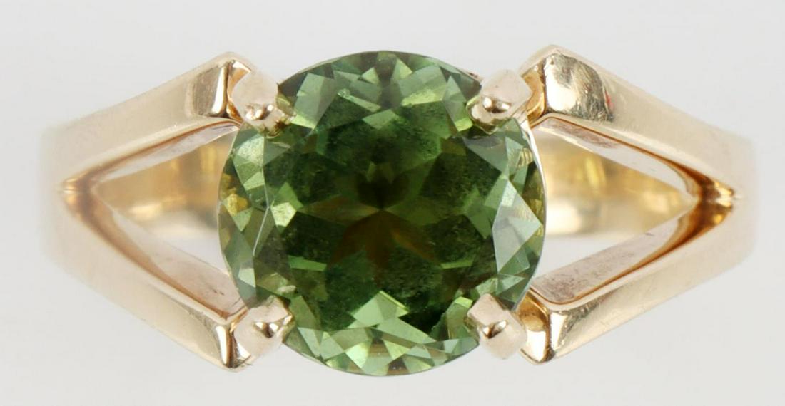 14KT GOLD SOLITAIRE RING W 2.5 TCW PERIDOT: Size 6.5. Marked "TRB 14kt" with a round faceted Peridot measuring 8.5 X 6mm. Approximate total carat weight of 2.5 carats. Total weight of 6.6 grams. This lot has a reserve.