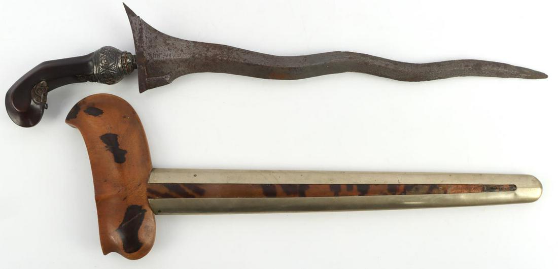 INDONESIAN KRIS DAGGER METEORITE BLADE: Steel blade with wooden grip. Inlaid faceted topaz stones and silver wrap on grip. Scabbard appears to be spalted rosewood. Measures 18 inches.