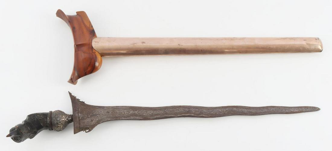 INDONESIAN KRIS DAGGER METEORITE BLADE: Steel blade with scorpion tail shaped wood grip. Housed in copper scabbard. Measures 18 5/8 inches. Very good condition.