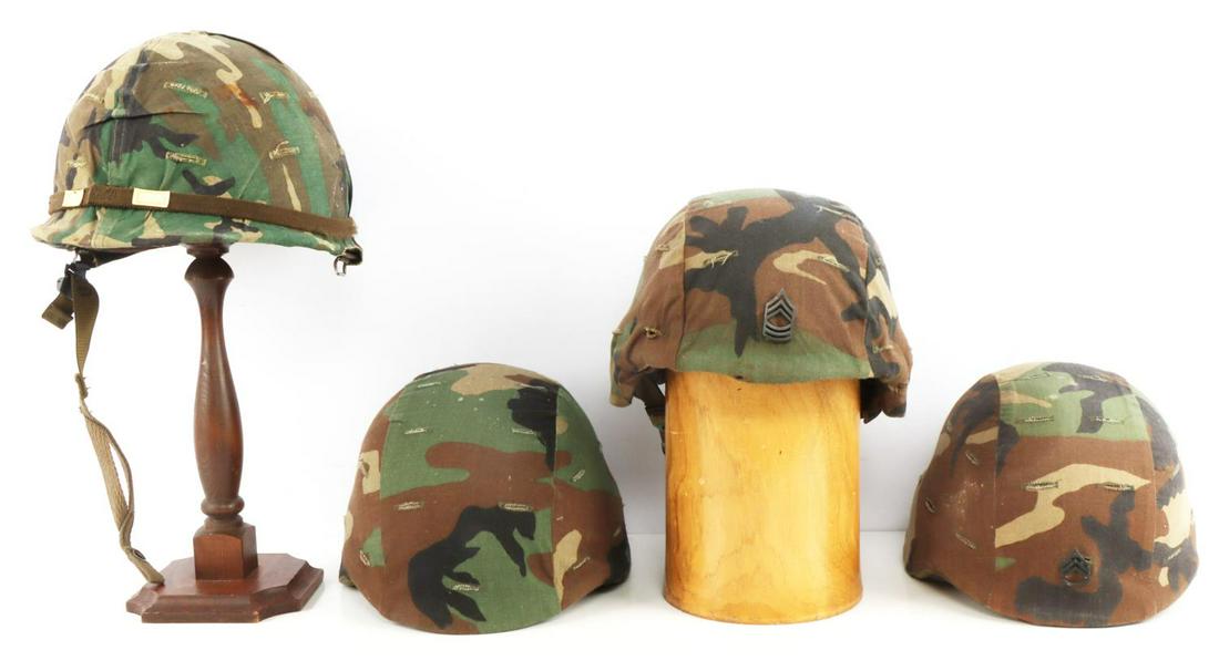 4 POST WAR US MILITARY PASGT & M1 CAMO HELMET LOT: Lot of 4 post-war United States military helmets including three PASGT helmets and one M1 helmet, all have woodland camo cloth coverings. Two PASGT helmets have rank insignias on the front, Master Ser