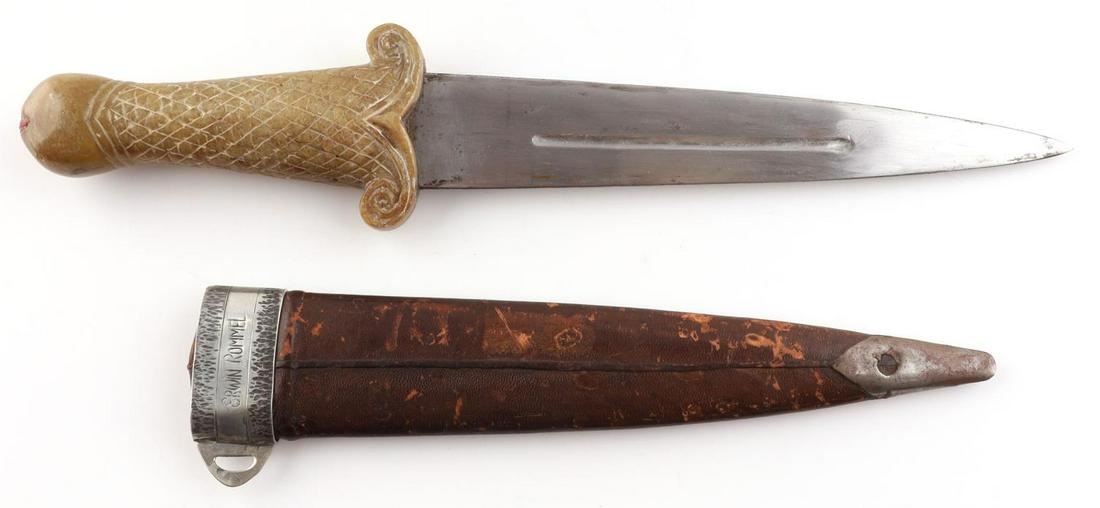 WWII GERMAN NORTH AFRICAN PRESENTATION DAGGER: Sheath is marked "Erwin Rommel" on one side of throat and has a swastika on the other side. Blade measures about 9 3/8 inches long. Handle is soapstone with fish scale design and fish mouth on pommel.