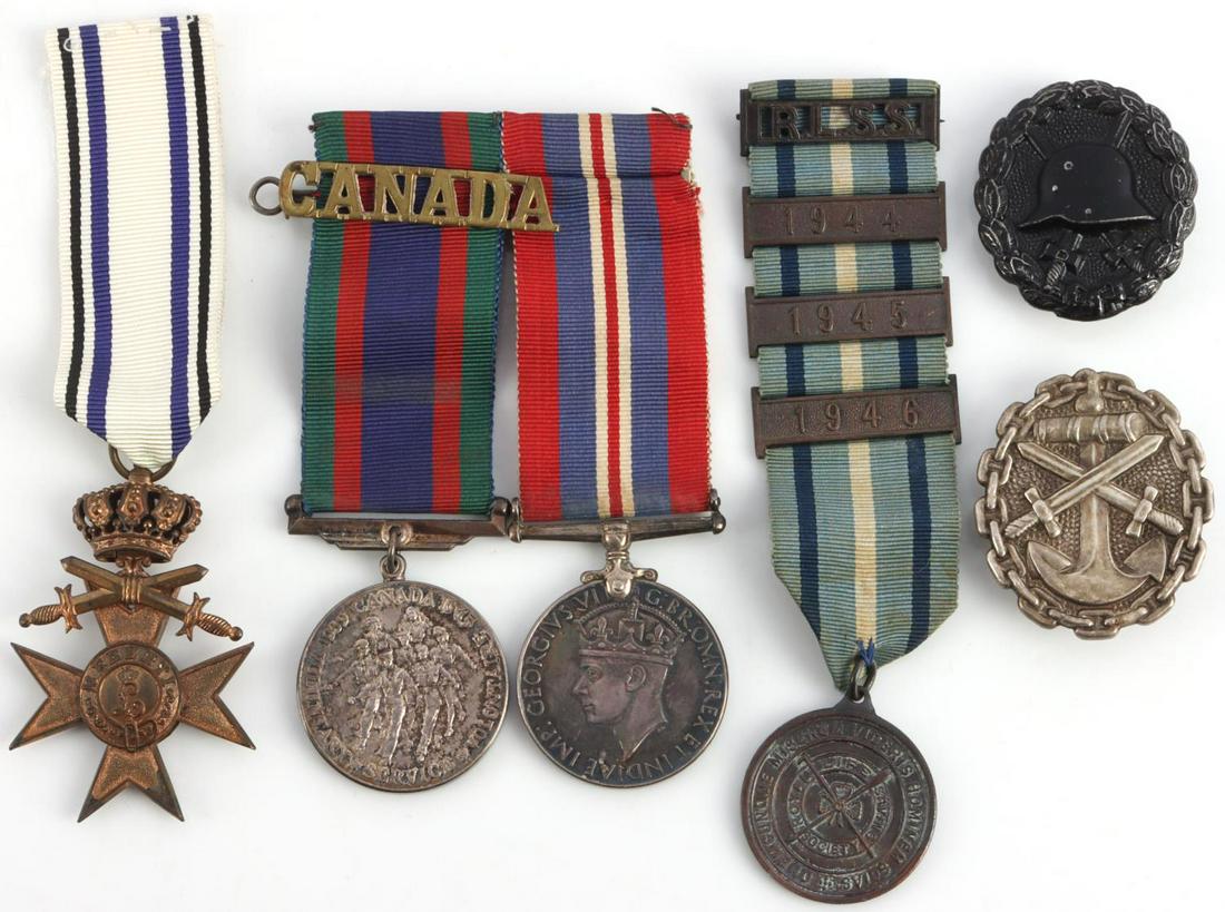 WWI MEDAL LOT GERMAN WOUND BADGE MILITARY MERIT: Lot of 6 features German Military Merit, Black Wound badge, German Navy wound badge, Royal Life saving society medal named to B.L. Holding with 4 bars, and 2 silver Canadian war medals. Measurements r