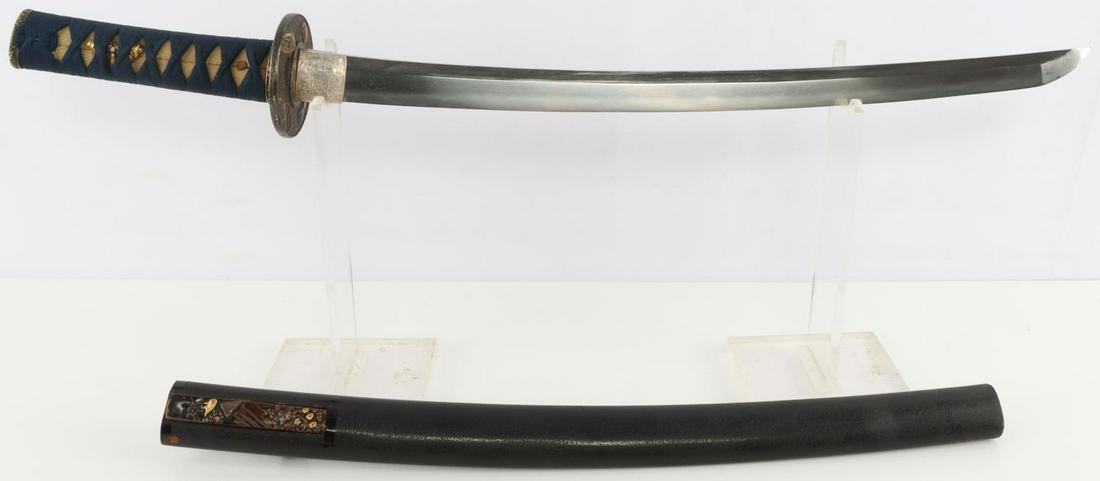 EDO TO WWII IMPERIAL JAPANESE WAKIZASHI SWORD: In full polish. Bright hamon with visible hada. Signature present on tang. Grip has shark skin with cotton wrap. Menuki appear to be upper class leaders. Light chipping near tip of the blade. Few tire