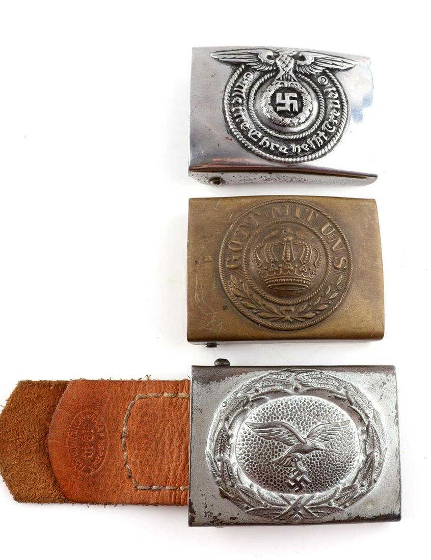 3 WWII GERMAN LUFTWAFFE WAFFEN SS EM BELT BUCKLES: 3 post-WWII German made belt buckles. One Luftwaffe EM belt buckle. 2 1/2 X 2 inches. Very good condition. One WWI Gott Mit Uns belt buckle. 2 1/2 X 2 inches. Very good condition. One Waffen-SS belt b