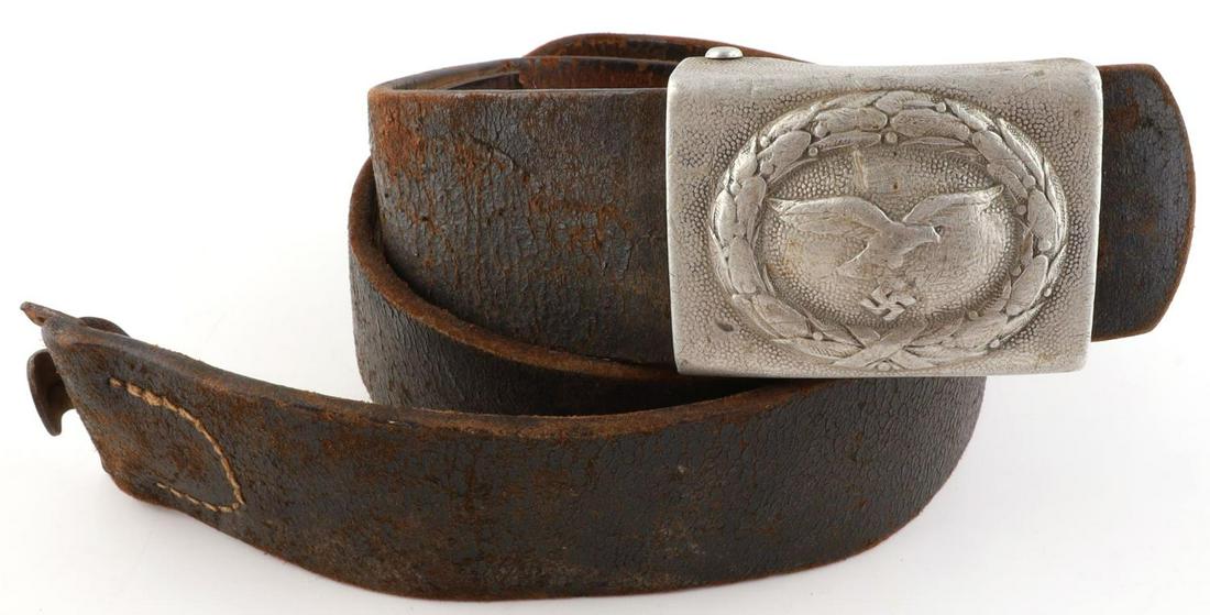 WWII GERMAN THIRD REICH LUFTWAFFE BELT AND BUCKLE: Aluminum buckle with leather belt. Buckle marked R S & S. Measures 2 3/8 X 1 3/4 inches. Belt measures 40 inches approximately. Very good condition with age wear.