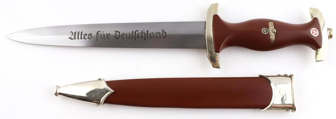 WWII GERMAN THIRD REICH SA HONOR DAGGER W SCABBARD: Steel blade with "Alles fur Deutschland" motto. Makers mark Boker Solingen. Plastic grip with inlaid eagle and SA rune. Measures 9 1/2 inches. Good condition. Unauthenticated, sold as is. This lot has