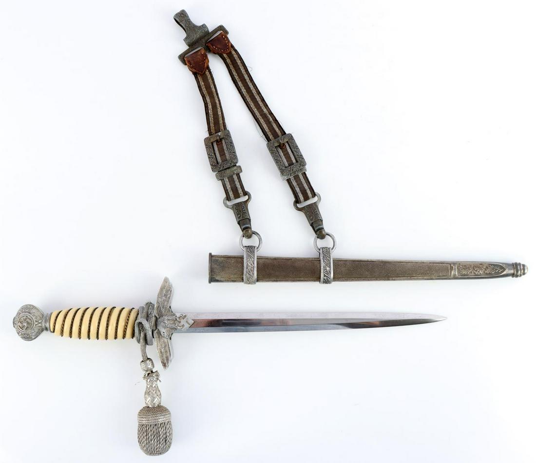 WWII GERMAN REICH LUFTWAFFE 2ND MODEL DAGGER: WII German Luftwaffe 2nd Model dagger with scabbard, hangers, and portepee. Aluminum pommel and crossguard with clear details. Bright and clean blade with a centered E & F Horster Solingen etched make