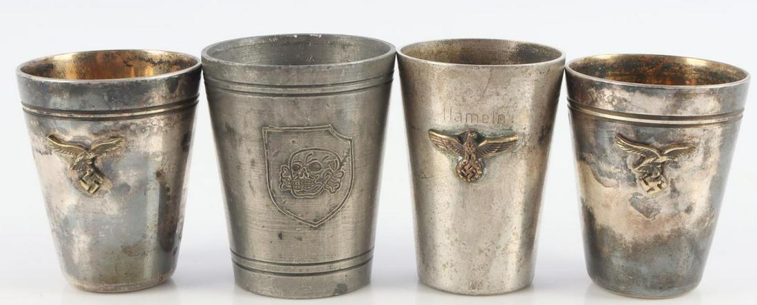 4 WWII GERMAN REICH LUFTWAFFE & SS SCHNAPPS CUPS: Lot of four (4) WWII German Reich schnapps shot cups including two Luftwaffe, one German Heer, and lastly one Waffen SS "Totenkopf" division shot cup. Cup sizes approx. 1 3/4 inches. Unauthenticated, 