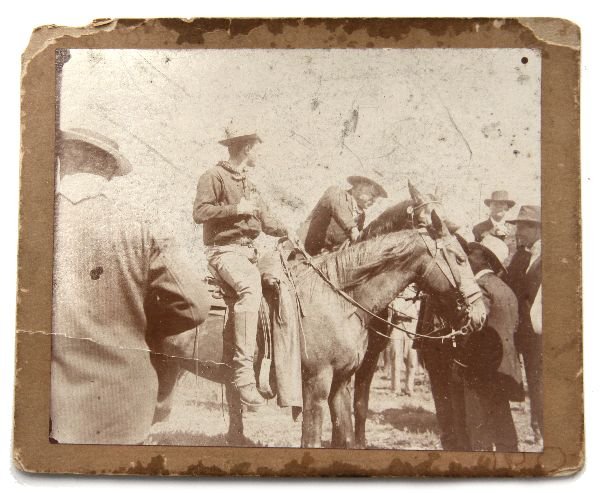 TEDDY ROOSEVELT ARREST PHOTO OKLAHOMA GOV BARNES: 4.5 X 3.75 inch of Theodore Roosevelt mounted on horseback. Reverse reads "Gov. Roosevelt immediately after his arrest by order of Gov. Barnes of Oklahoma" in ink followed by Quote from each man in pe