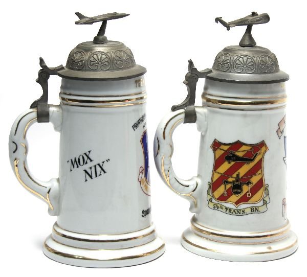 TWO US STEINS 2137 COMM SQ & 4TH TRANS CO NAMED: Two US unit commemorative steins. 4th Transport Co 54th Transport Bn., Hanau, Germany, named to Wayomon D. Dyson; 2137 Communications Service, Spangdahlem Air Base, Germany, named to Terry A. Howard. 