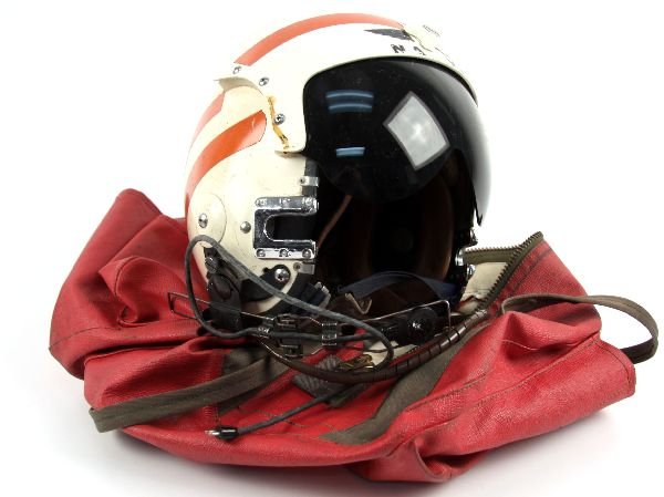 USN FIGHTER PILOT HELMET IN BAG NAMED: US Navy fighter pilot flight helmet in helmet bag, named to Paul Clemens. Helmet is complete with wiring attachments and microphone. Some scratches and wear from use, but overall good condition.