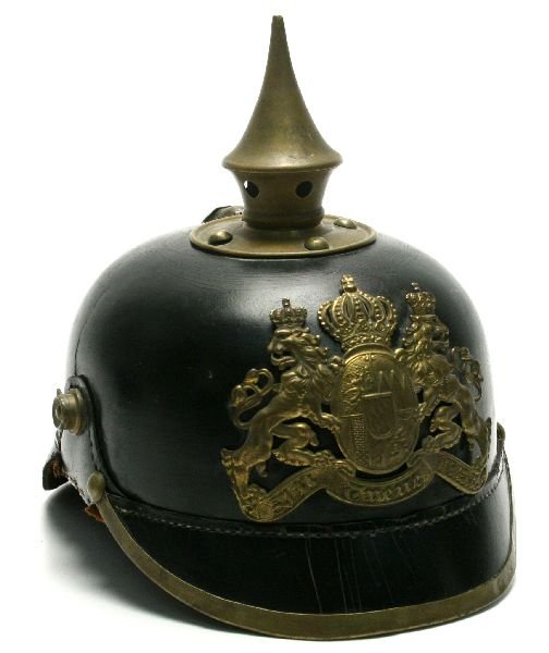 WWI BAVARIAN PICKLEHAUBE HELMET: WWI Bavarian picklehaube helmet. Plate on front reads "In Treue Fest" with rampant lions and coat of arms. Liner and chinstrap missing, and repair made to right side of helmet. Leather is brittle from