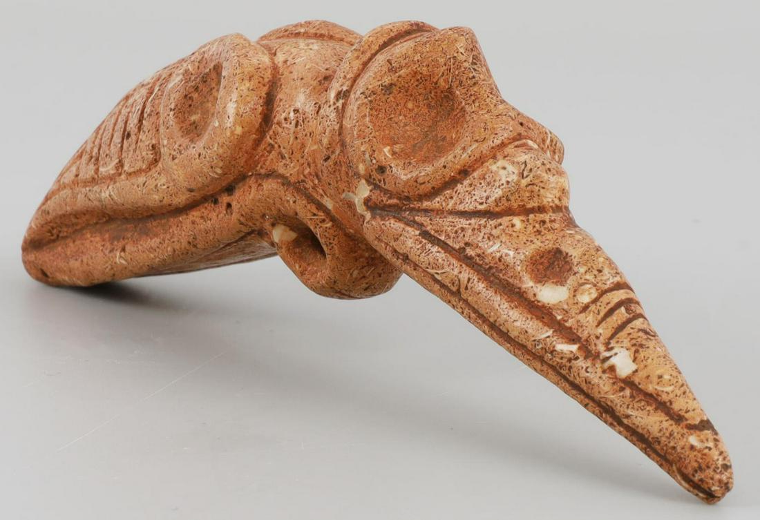 TAINO PRECOLUMBIAN BIRD PENDANT TRIPLE FACE: Taino. PreColumbian. An outstanding bird pendant with 3 facial representations. First, the initial bird head, second a bird head sculpted into the beak and third a face appears at the top of the head 