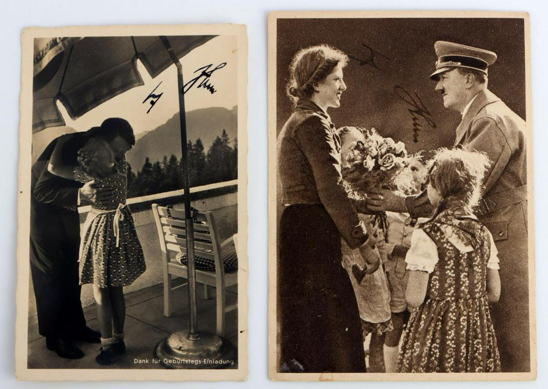 WWII GERMAN HITLER AUTOGRAPH LOT OF 2: Lot of 2 post cards with Adolf Hitler's signature. Both signed in pen and feature age. They measure 5 3/4 X 4 1/8 inches and both feature writing on reverse. Very good condition.