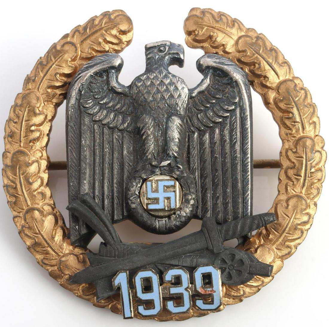 WWII GERMAN GAU HONOR BADGE WARTHELAND: Oak leaf wreath with Reichsadler in the center. Blue enamel coloring swastika and numbers. No maker on reverse. Measures 2 inches. Very good condition.