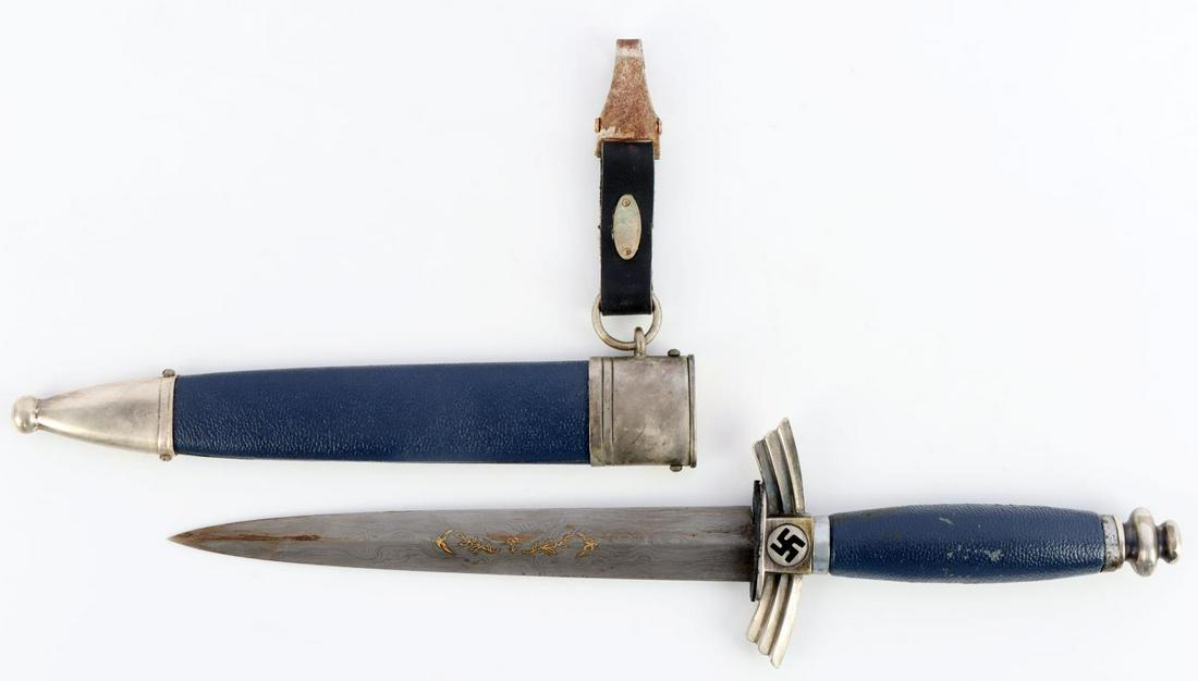 WWII GERMAN REICH LUFTWAFFE DLV DAMASCUS DAGGER: German Third Reich Luftwaffe DLV dagger. Features blue scabbard and grip with nickel fittings. Beautiful Damascus blade with raised gold Luftwaffe eagle and laurel leaves and SMF maker. Good condition