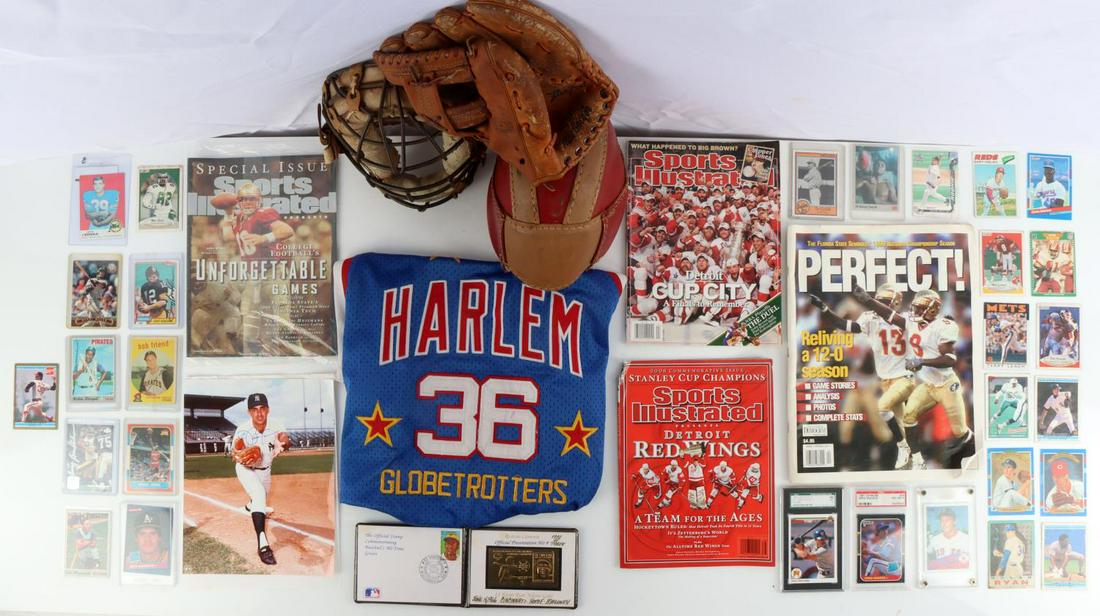 VINTAGE SPORTS LOT GLOBETROTTERS GEORGE FOSTER: Assortment of vintage sports lot. One Macgregor G23T glove signed by Cincinnati Reds George Foster. Signed three times in black pen. Twice on the middle and ring finger and a clearer one on the palm. 