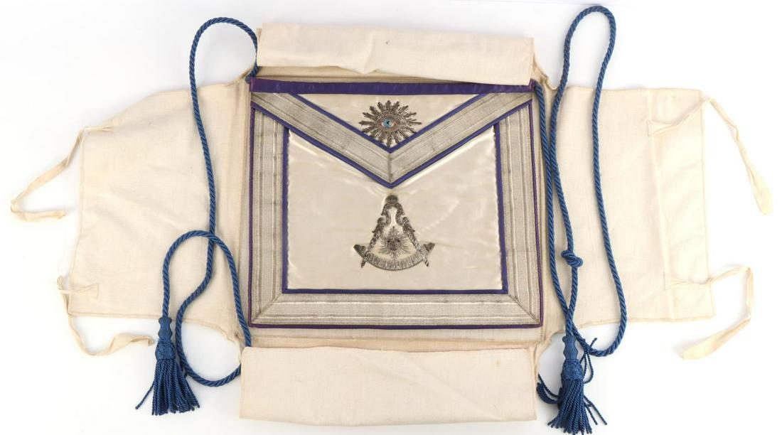 BULLION WIRE MASONIC MASON APRON BUFFALO LODGE: With its original soft canvas carrying case, silver bullion wire"All seeing eye" and the other imagery. Under the flap named to W. Robert Carlton Master 1946 By Lakeland Lodge No. 952 This lot has a r