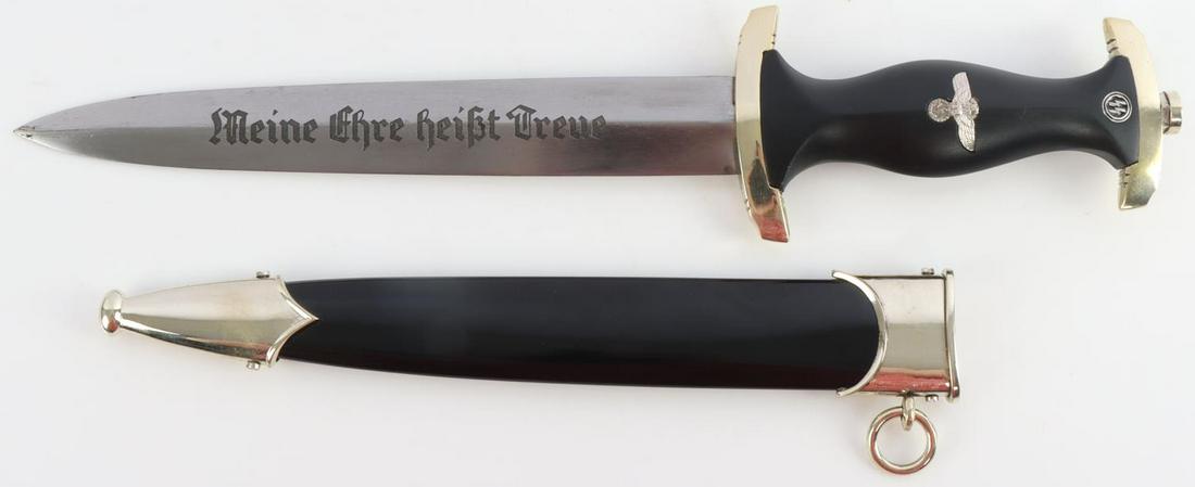 WWII GERMAN THIRD REICH SS DAGGER WITH SCABBARD: A WWII German Reich SS Dagger with scabbard made by "Boker. Solingen." Makers mark on ricasso of blade, inscription which reads "Meine Ehre Heisst Treue". Blade length 8 1/4 inches. Unauthenticated, s