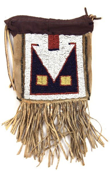 PLAINS INDIAN BEADED MEDICINE BAG: Well crafted plains Indian beaded medicine bag. Twentieth century original item, glass beaded fringe measures 7 x 6 inches and very good.
