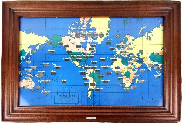 HOWARD MILLER WORLD TIME WALL CLOCK: Howard Miller World Time clock. Measures 17 by 23 by 3.5. Appears to be in working condition. We do not warrant the working condition of time pieces.
