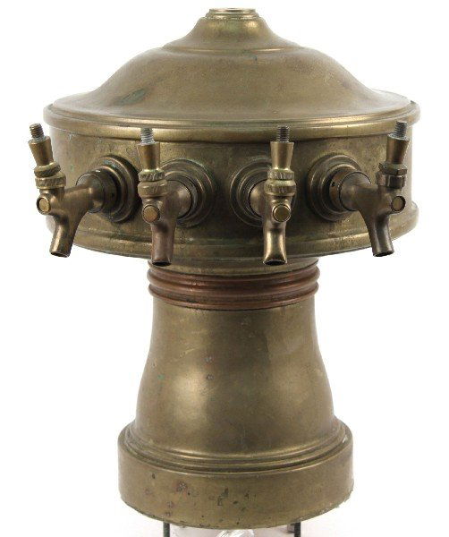 VINTAGE BRASS FOUR HEAD BEER TAP: Vintage brass four head beer tap. Brass badge on back reads "ON DRAFT". Four bolts on bottom for mounting to bar. Hairline crack in back, otherwise good condition.