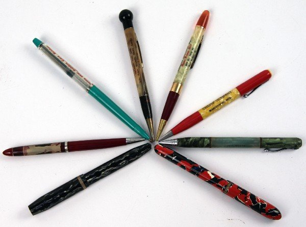 VINTAGE PEN & PENCIL COLLECTION NUDIE ADVERTISING: Collection of mechanical pencils and pens, includes nude, Golden Gate Bridge floating airplane, 4 advertising , and 2 ripple, off makers none currently work.