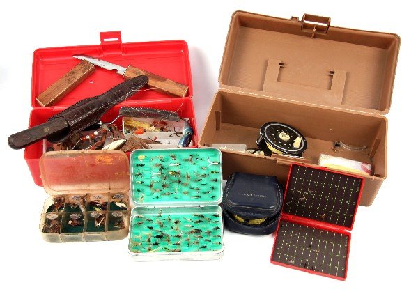 TWO TACKLE BOXES FULL OF VINTAGE TACKLE: Two tackle boxes filled with vintage tackle. lures, several boxes of flies, two fly reels, two fish knives, and more. Items vary in condition.