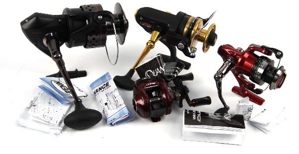LOT OF FOUR FISHING REELS PENN & QUANTUM: Four fishing reels. Penn Sargus 8000, Penn 450, Quantum Kinetic PT20, and Quantum KT100sPT. All in excellent condition appearing unused.