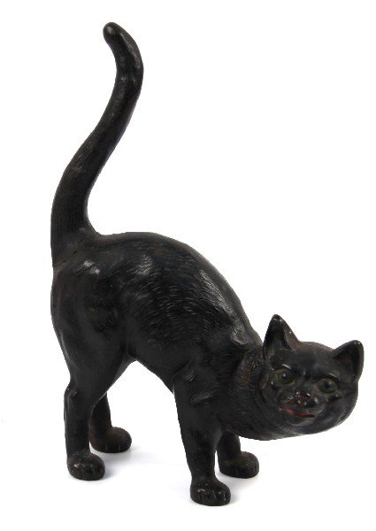 BLACK CAT CAST IRON DOOR STOPPER CIRCA 1900S: Iron black cat doorstop circa early 1900's. Measures 11 by 4 by 2 inches. Tail appears to have been repaired, overall in very good condition. Original paint.