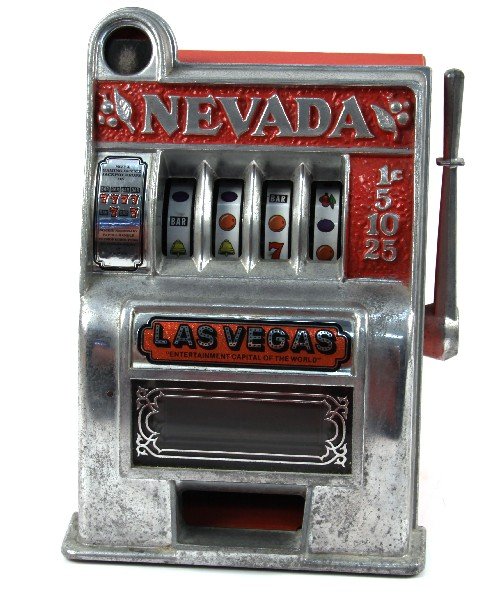 1950'S ERA NEVADA 11 INCH SLOT MACHINE TOY BANK: Good working condition. Original paint in very good condition. Nickel finish has spotting. Decals in very good condition. 11 by 8 inches.