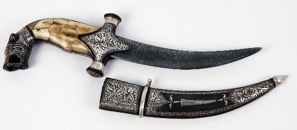 MIDDLE EASTERN JAMBIYA DAGGER WITH BONE GRIP: Middle Eastern jambiya dagger, with 5 inch patterned steel blade and bone grip. Overall good condition.