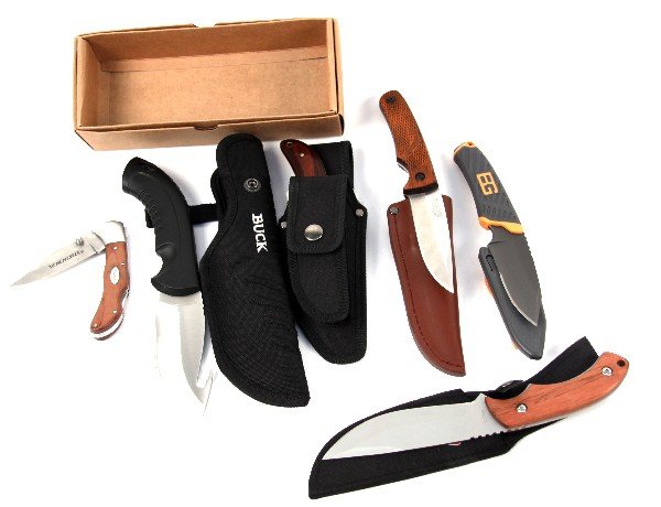 SIX SPORTSMANS & UTILITY KNIVES BUCK GERBER & MORE: Six various outdoor and hunting utility knives. Elk Ridge ER-103 fixed blade and folding knife set, in box; Buck 393 skinning knife, Coleman utility knife, Gerber Bear Grylls, Winchester folding, and 