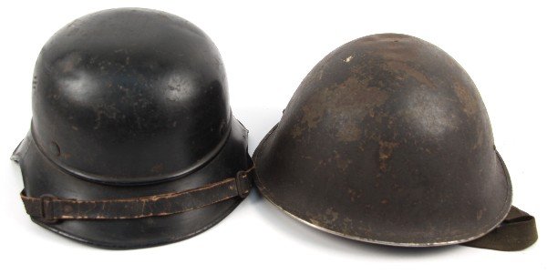 WWII GERMAN LUFTSCHUTZ & BRITISH TURTLE HELMETS: Two WWII Helmet shells. A German Luftschutz helmet with strap, no liner, and a British MK III Turtle helmet with strap, no liner. Both fair condition.