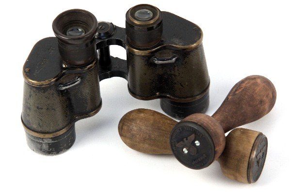 WWII GERMAN ITEMS BINOCULARS & STAMPS: WWII German field binoculars, and two wooden document stamps. Binoculars are well worn, stamps are in very good condition.