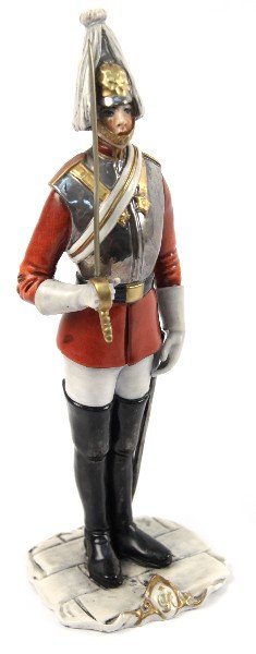 CACCIAPUOTI BRITISH QUEENS HORSE GUARD PORCELAIN: A porcelain figurine made by Italian company Guido Cacciapuoti standing 9 inches tall. Incised stamp on bottom includes #2106 and #2107. In very good condition with not chips cracks or repairs visible